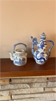 2 oriental teapots