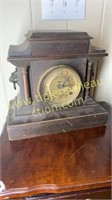 Antique mantle clock with lion heads