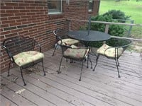 Wrought iron table w 4 chairs and cushions