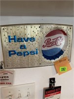 Plastic Pepsi sign 8 x 13”. Has crack