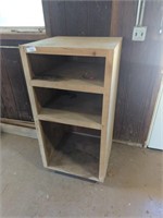 Homemade wooden shelf approximately 4 ft tall by