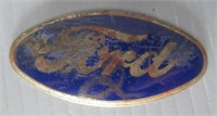 Enameled Ford piece. Measures: 1.5" H x 3" L.