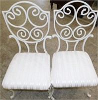 Pair of vintage iron chairs with upholstered seats
