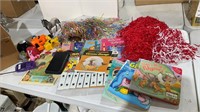 Assorted books, Pom Pom’s, kids toys