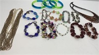 10 beaded bracelets, 3 bangles, 2 necklaces