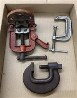 assortment of clamps and vises