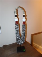 Indonesian Shell Necklace on stand