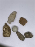 Locally found arrowheads, clay marble, fossil,