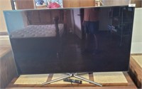 SAMSUNG 60 IN TV ON STAND W/ REMOTE