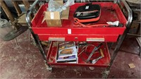 Red tool cart and  bottom lower shelf contents
