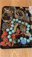 Half a tray lot of costume jewelry, including