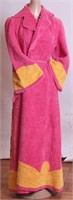 A vintage full length pink chenille bathrobe