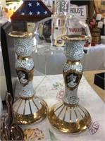 Pair of decorated candleholders
