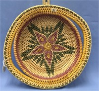 A grass serving tray, 9" diameter with a floral de