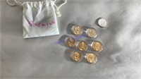 7 Sacagawea dollars plus 1 commemorative