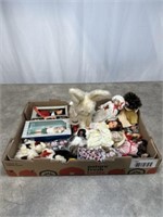 Assortment of small dolls and bunny. Some in