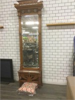Ornate wood entry mirror with marble counter and
