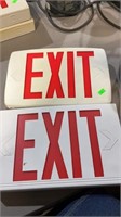 Two exit signs