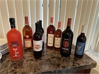 Nine collector bottles incl Winking Owl & Sangria