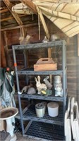 PLASTIC SHELVING UNIT WITH LAWN ORNAMENTS