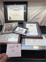 Awards, prints, and diploma.