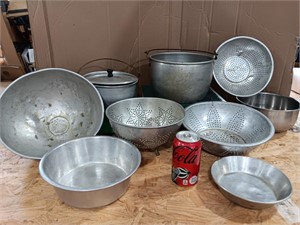 Vintage metal colanders, pots, pans.