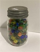 Vintage pint jar filled with marbles and