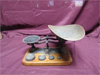 Cast iron scale w/weights. Counter top.