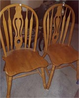 2 wood matching high back dining room chairs.