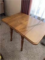 Mid century modern end table with drop sodes,