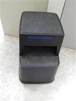 Black plastic step stool rolls