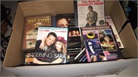 Box full of movies, DVD’s, and music cd’s
