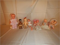 10 assorted plastic dolls: