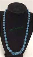 Beautiful egg shaped marble-look beaded necklace.