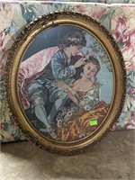 Needlepoint Artwork of couple lounging in oval