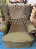 Green upholstered rocker by Pontiac  (in basement)