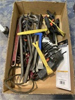 Box with lots of various shape bars, pipe wrench,