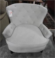 Pier One khaki upholstered and tufted open arm