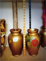 2 gold vases on floral on plain