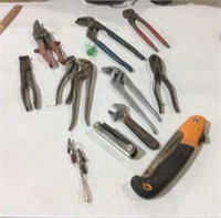 Adjustable pliers, tin snips, nail puller and