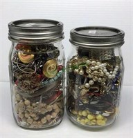 2 quart size jars of assorted jewelry pieces for