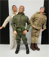 Three vintage G.I. Joe dolls with clothing and