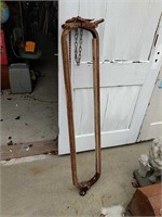 Antique metal and wood dairy cow headgate