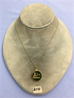10K gold pendant and chain with a jade carving of