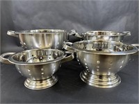 Four Stainless Steel Colanders