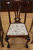 UPHOLSTERED DINING CHAIR WITH CARVED CLAW FEET