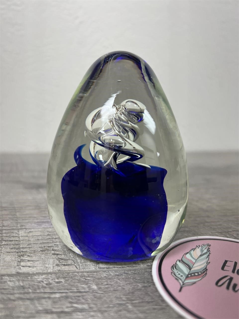 Blue and clear swirly glass paperweight