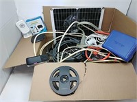 Large box of cords, lights, solar panel & more