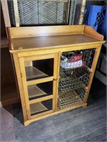 Unique wooden storage cabinet. Has three pull out