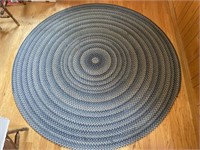 Round braided floor rug measuring 85 inches in